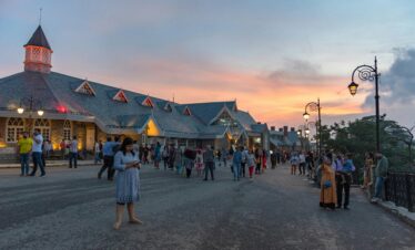 Mall Road in Shimla with tourists enjoying shops and scenic mountain views