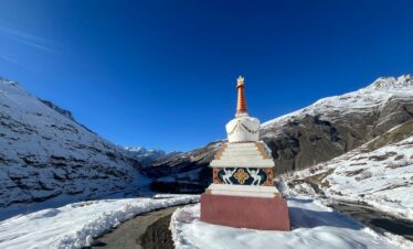 Snow-covered mountains and scenic landscape of Sissu village in Lahaul Valley near Manali